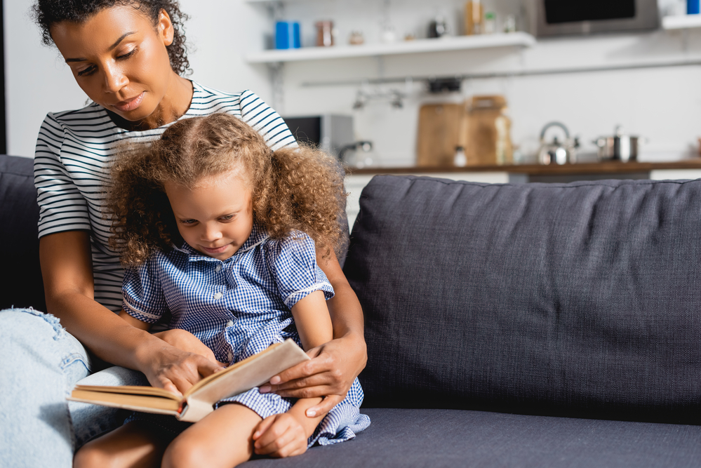 Woman teaches child to read