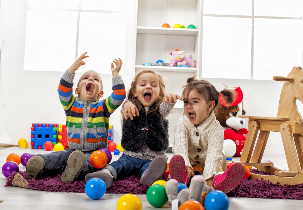 Three kids playing a room