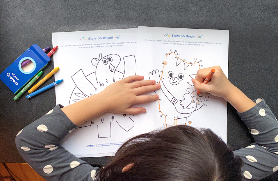 Child working on Stars so Bright printable with crayons