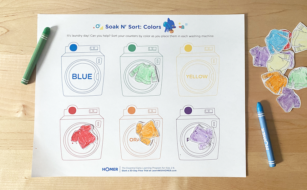 Completed Soak n Sort printable on table with crayons