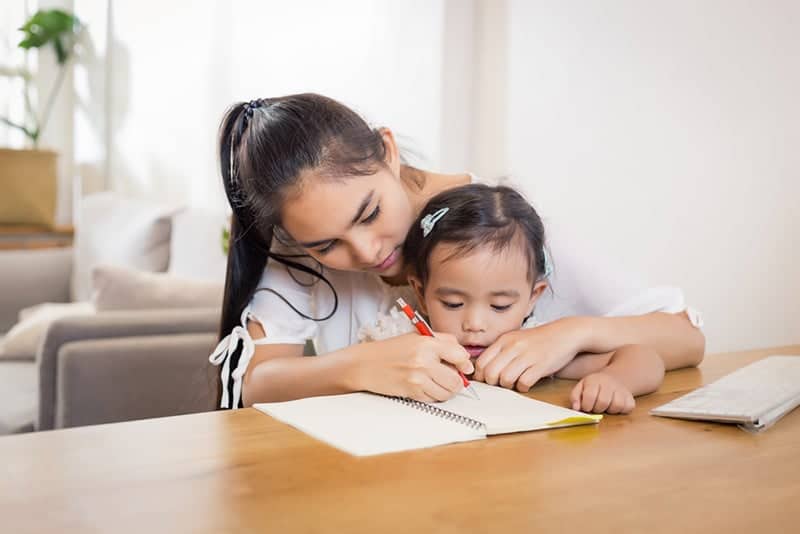 Mother and child working on pre-writing activities together