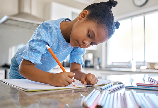 young girl writing