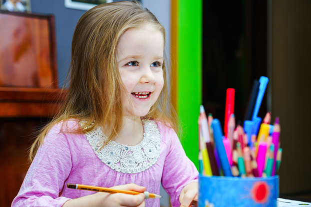 young girl doing an art project