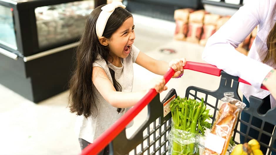 Child having temper tantrum at the grocery store