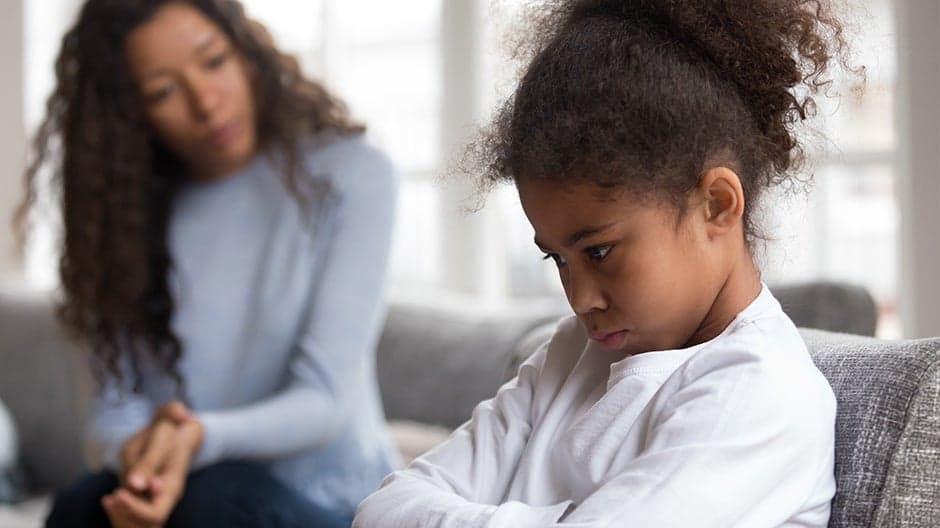 Mother helping daughter work through her emotions