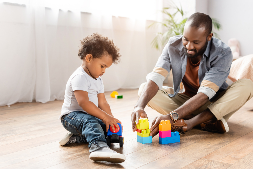 dad playing with 3 year old