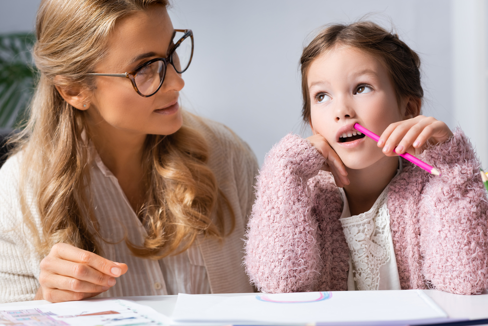 Mom with daughter helping with home work