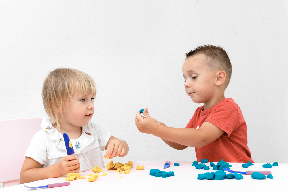 kids playing with playdough