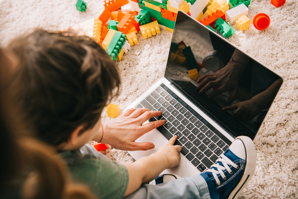 Kids using laptop to learn letter sounds