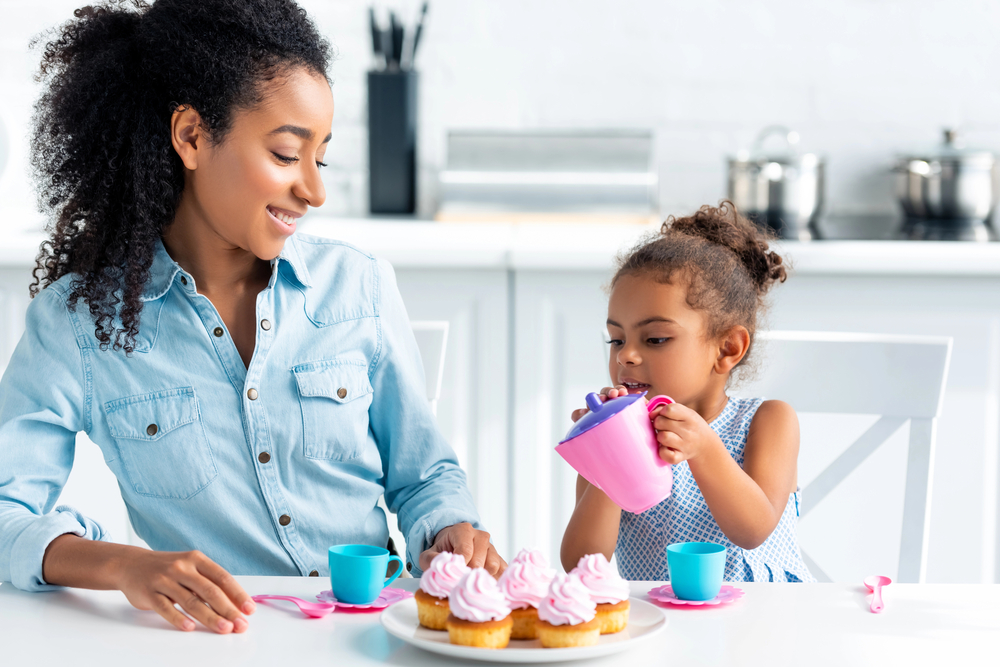 Mom baking cupcakes with daughter