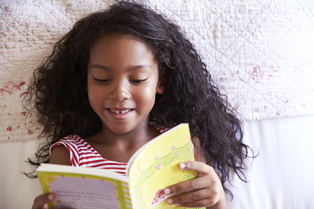 Girl doing her 3rd grade reading
