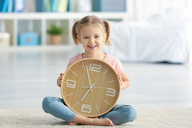 Kid learning how to tell time Kid learning how to tell time