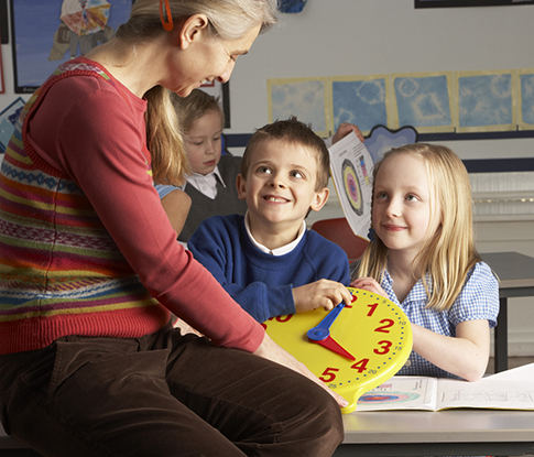 Teacher teaching kids how to tell time
