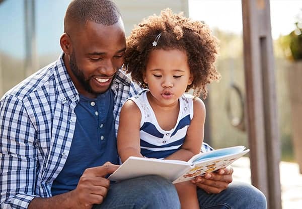 Dad reading with child