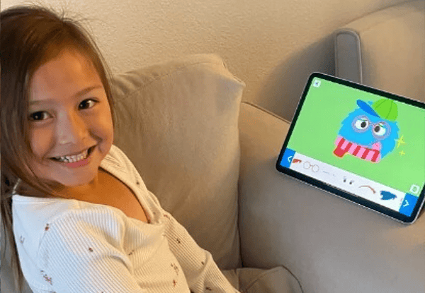 kid playing on a tablet